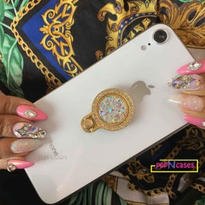 gold rhinestone phone grip ring on iphone