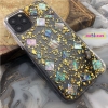 iridescent sea shell with golden flakes on black iphone 11